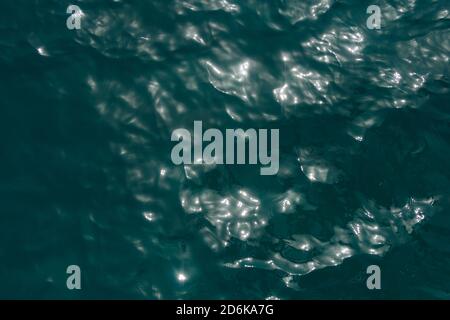 Blue tones of the water. The waves. The surface as the background. Sea view from above Stock Photo