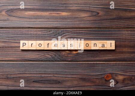 Professional word written on wood block. Professional text on cement table for your desing, concept. Stock Photo