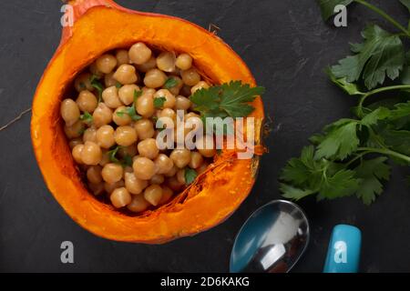 Hokkaido pumpkin baked with chickpeas. Keto diet, top view Stock Photo