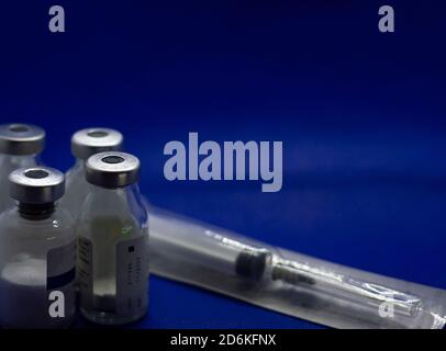 Vaccine bottles with syringe in the package Stock Photo