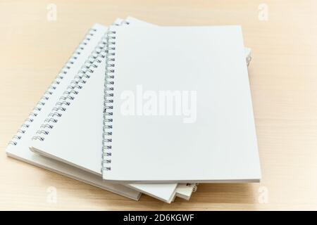 Stack of white notepads on the conference table Stock Photo