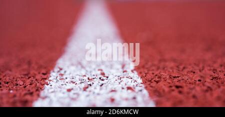 finish line. health and sport. path for runners. racetrack on outdoor stadium. stadium arena soccer field. healthy sports life. treadmill in gym. running track in selective focus. Stock Photo