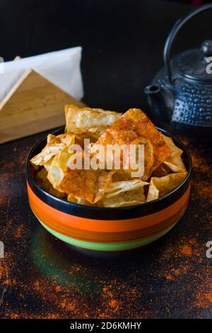 nachos chips and beer snack in the colorful bowl on the table in restaurant Stock Photo