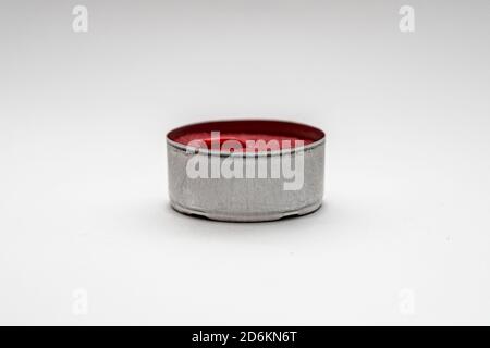 Small decorative red candles in metal case isolated on a white background Stock Photo
