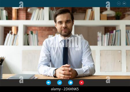 Head shot portrait screen view confident businessman at workplace Stock Photo