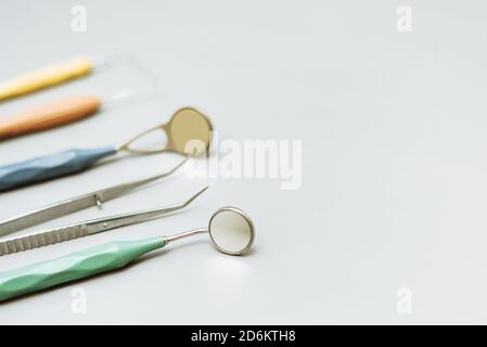 Dentist tools on a gray background. Modern instruments for dental treatment. Copy space. Stock Photo