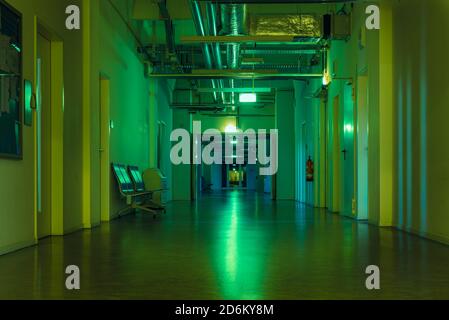 A long, dark hallway in a public building, no people Stock Photo