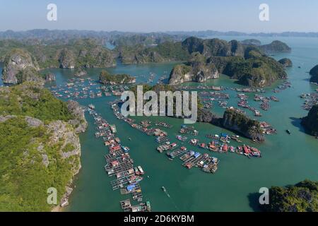 Floating Village on Ha Long Bay, Cat Ba Island, Vietnam, descending dragon bay Asia Aerial Drone Photo View Stock Photo