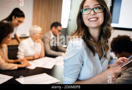 Group of business people working together, brainstorming in office Stock Photo
