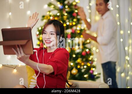 Video calling friends on Christmas Stock Photo