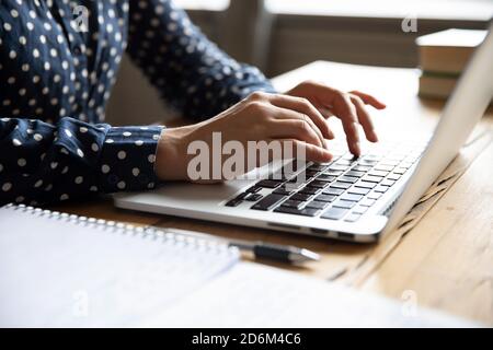Close up view image female hands typing on laptop keyboard Stock Photo