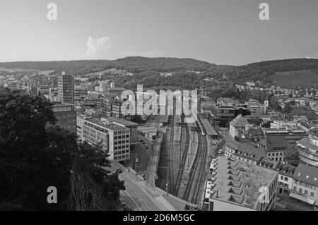 Switzerland: The view to the train station of the old town of Baden City and the industrial zone in canton Aargau from the chateau above Stock Photo