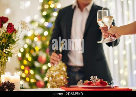 Couple clinking champagne glasses Stock Photo
