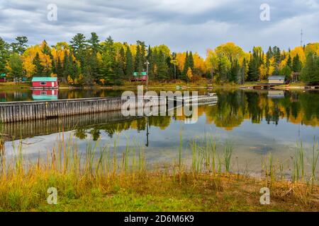 Fall foliage color and lakeside cottages  near Sioux Narrows, Ontario, Canada. Stock Photo