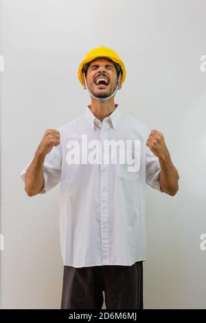 Worker with helmet isolated on white background. Black man in a helmet with various expressions. Stock Photo