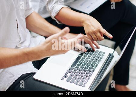 Analyzing data on screen Stock Photo