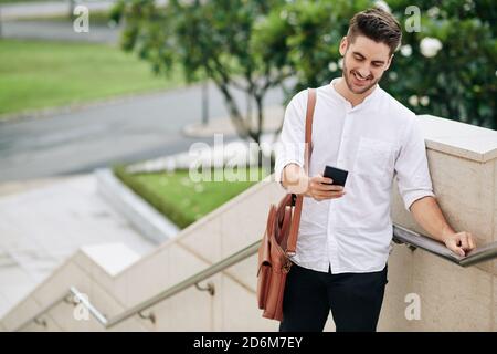 Man reading text message Stock Photo