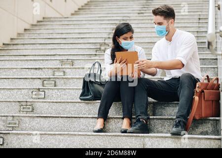 Entrepreneurs watching presentation Stock Photo