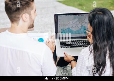 Entrepreneurs discussing report Stock Photo
