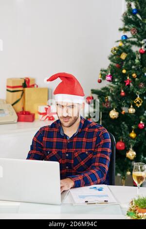 Working in office on Christmas Stock Photo