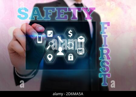 Writing note showing Safety First. Business concept for Avoid any unnecessary risk Live Safely Be Careful Pay attention Information digital technology Stock Photo