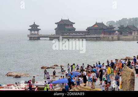 Qinhuangdao / China - July 23, 2016: Laolongtou Great Wall (Old Dragon's Head) scenic area, where the Great Wall of China meets the Bohai Sea Stock Photo