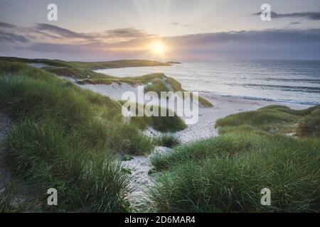 Beach at Baleloch during sunset, North Uist, Outer Hebrides, Scotland Stock Photo