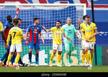 Match referee Stuart Attwell shows Brighton and Hove Albion's Lewis Dunk a red card during the Premier League match at Selhurst Park, London. Stock Photo