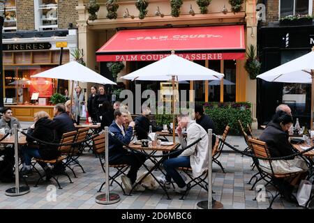 Covent Garden, London, UK. 18th Oct 2020. Covent Garden cafes and restaurants are busy on Sunday afternoon the day after the city went into Tier 2 Covid rules. Credit: Matthew Chattle/Alamy Live News Stock Photo