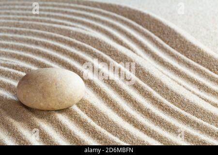 Single stone in a japanese zen garden Stock Photo