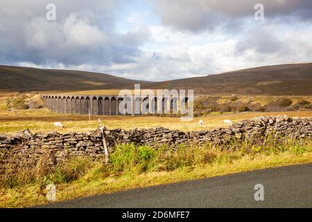 The Ribblehead viaduct carrying the Settle to Carlisle railway over Blea moor in Ribblesdale North Yorkshire Dales England UK with Whernside behind Stock Photo