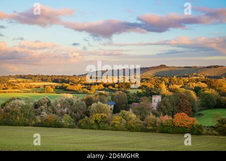 Autumn view over the village of Shalbourne with Ham Hill and Inkpen Hill behind at sunset, Wiltshire, England, United Kingdom, Europe Stock Photo