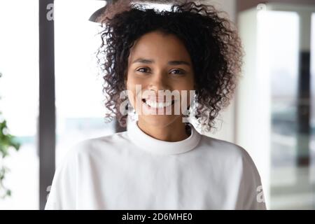 Close up portrait of smiling young african american businesswoman. Stock Photo