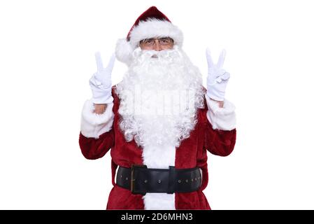 Senior man wearing a traditional Sant Claus costume with his hands raise making a vee gesture. Victory Concept. Stock Photo