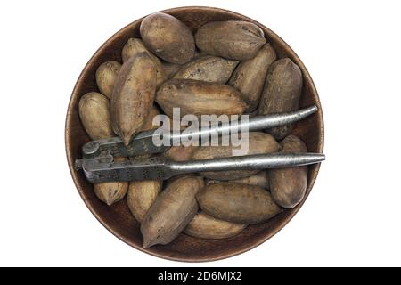 pecan nuts in a wooden bowl isolated on white background Stock Photo