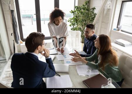 African ethnicity female speaker presenting company financial results. Stock Photo