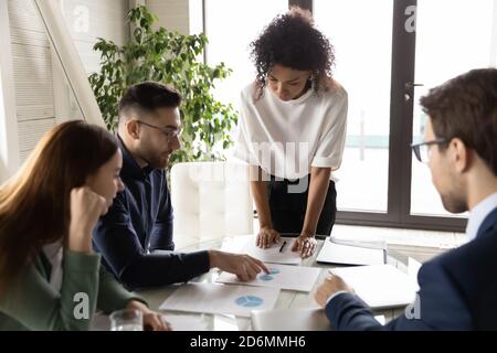 Young middle eastern arabian ethnicity male employee explaining research results. Stock Photo