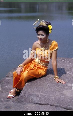 a cambodian bride in traditional dress poses for a pre wedding photo at angkor wat cambodia 2d6mn85