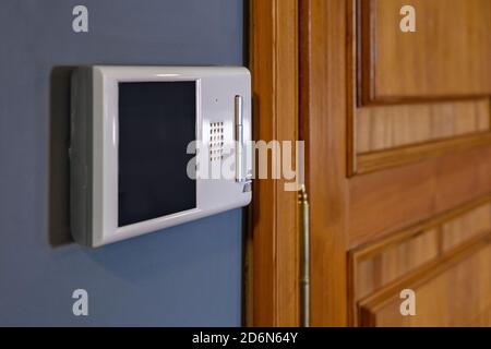 Video intercom display near the entrance door at home close up Stock Photo