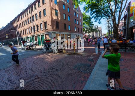 Tourists in a horse carriage ride, Quincy Market, Boston, Massachusetts, USA Stock Photo