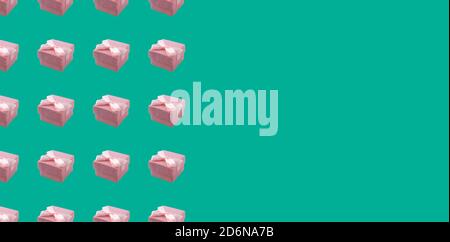 Geometric pattern, pink gift box with a bow on a turquoise background with space for text. Template. Stock Photo