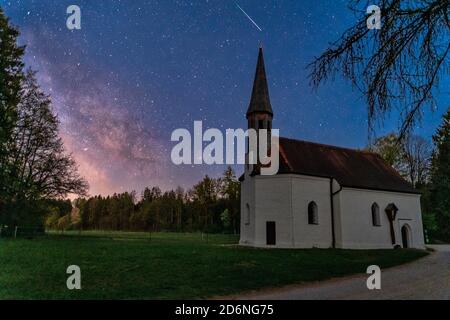 The impressive Milkyway, stars to dream, a wonderful starry night in front of a little chapel in southern germany Stock Photo