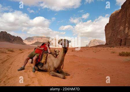 man on camel in jordan Stock Photo