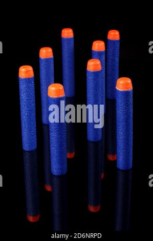 Toy gun bullets made from foam and rubber isolated on the black background Stock Photo