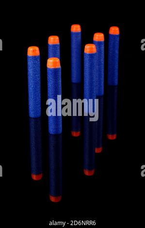 Toy gun bullets made from foam and rubber isolated on the black background Stock Photo