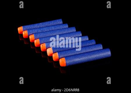 Toy gun bullets made from foam and rubber isolated on the black background Stock Photo