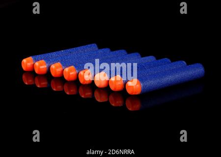 Toy gun bullets made from foam and rubber isolated on the black background Stock Photo