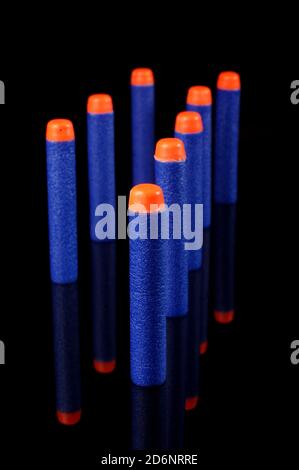 Toy gun bullets made from foam and rubber isolated on the black background Stock Photo