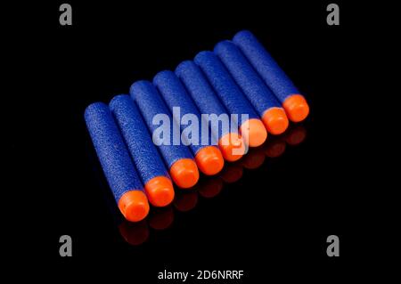 Toy gun bullets made from foam and rubber isolated on the black background Stock Photo