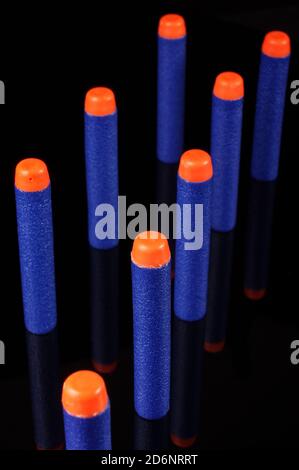 Toy gun bullets made from foam and rubber isolated on the black background Stock Photo